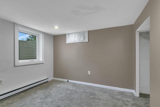 Lower Bedroom with double closet and Egress window