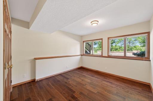 5th bedroom with windows facing the lake