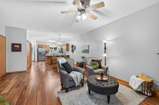 The open floor living/dining/kitchen has beautiful updated flooring