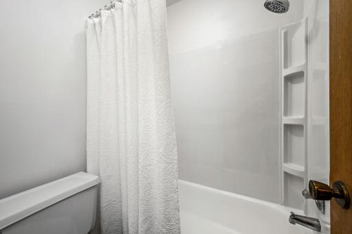 The private bath area features a brand-new shower and surround.