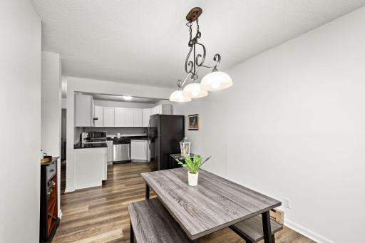 An inviting dining space flows seamlessly into the kitchen.