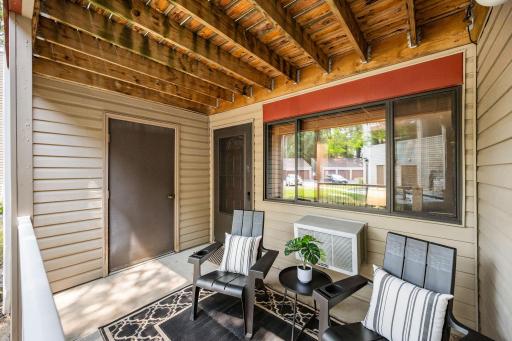 The covered front patio is a wonderful extension of the living space with direct access into your home and a private storage locker.