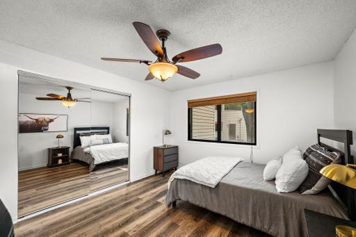 The spacious bedroom features a large closet and abundant natural light.