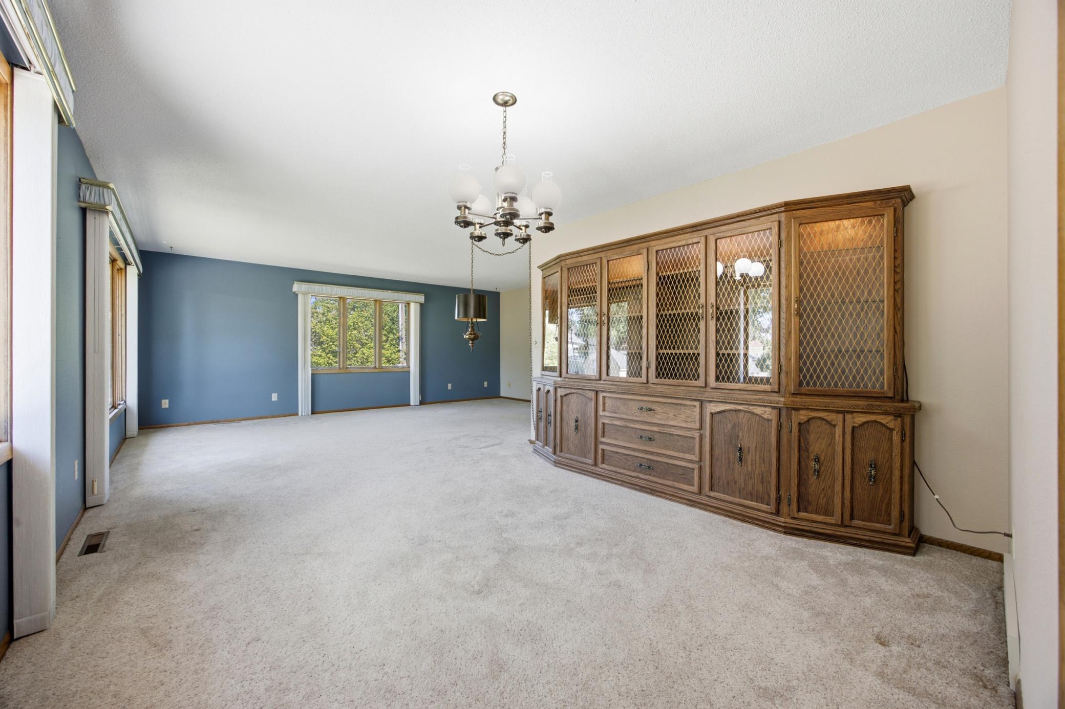 formal dining with built in hutch & living room