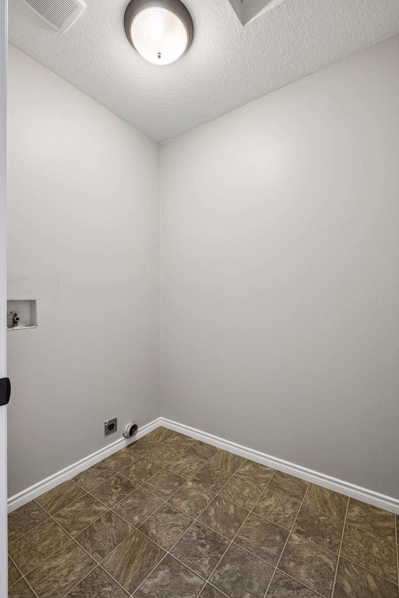 Main Floor Laundry - Washer / Dryer Hookup