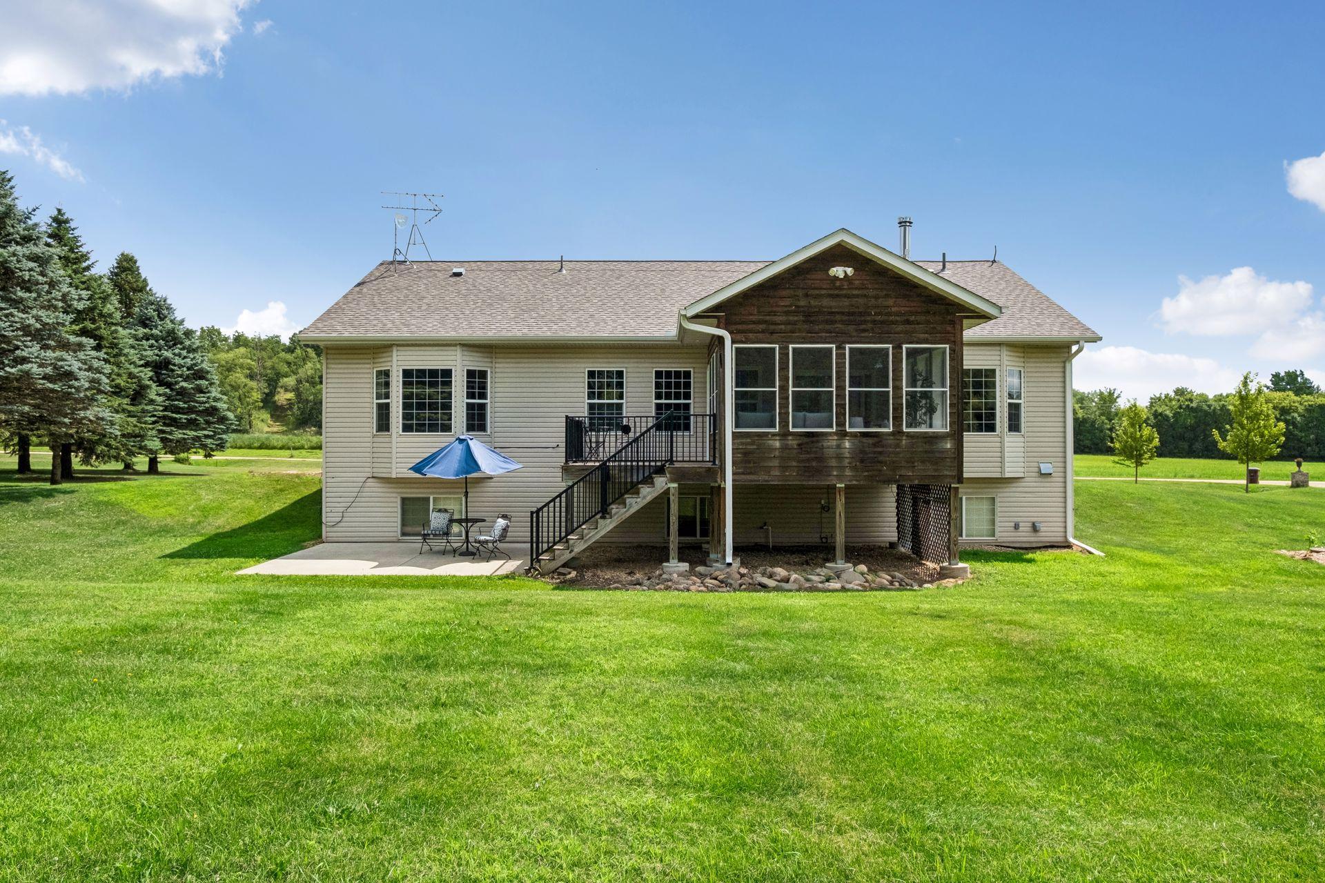 A Charming View of the Back of the Home Spacious Lot and Peaceful Setting