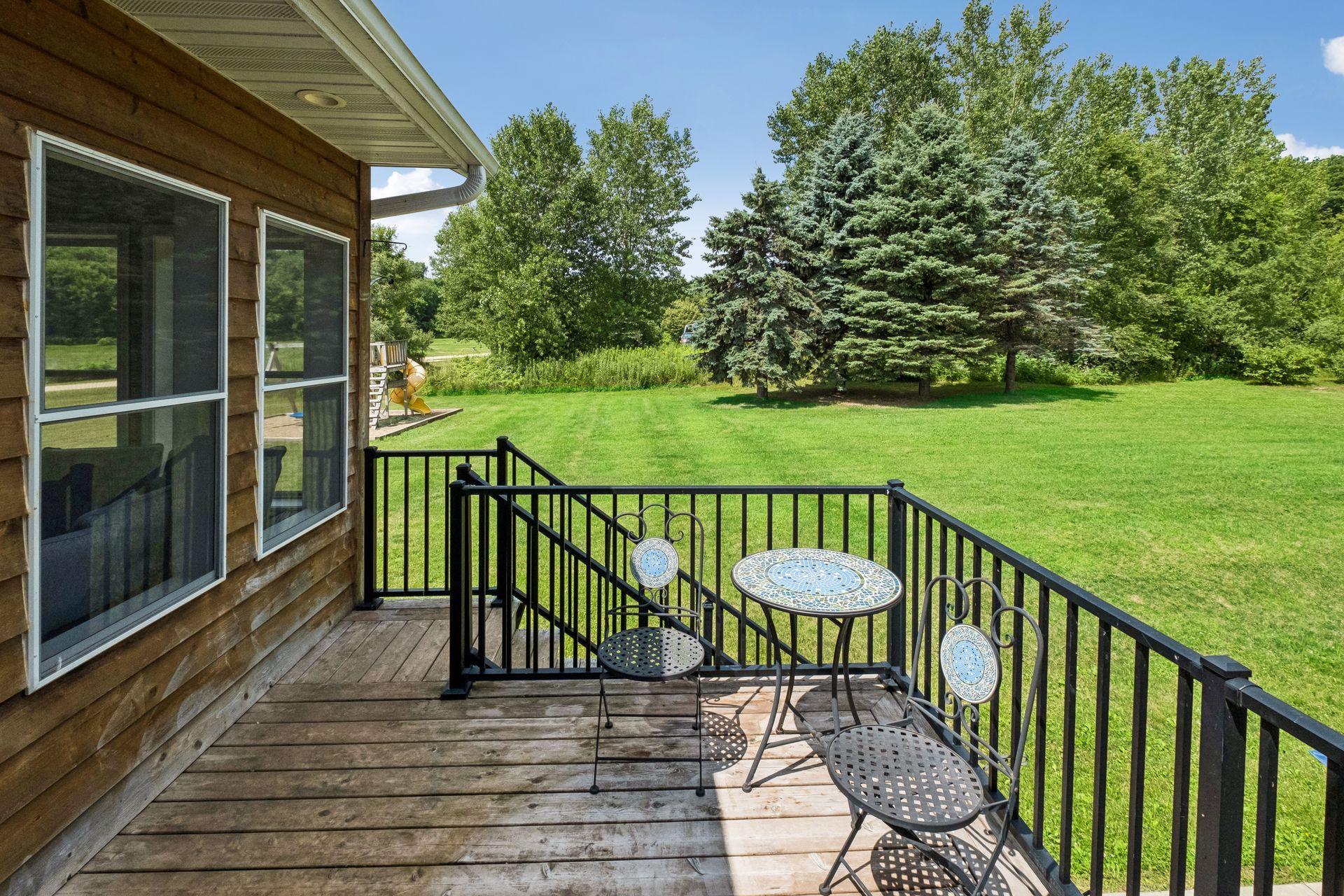 A Cozy Side Porch Overlooks Peaceful Green Space