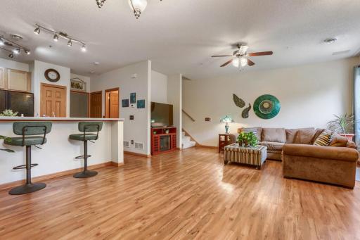 The dining area flows effortlessly from the living room, offering a sophisticated setting for intimate dinners and larger gatherings alike. Thoughtfully designed for comfort and style, these spaces combine timeless appeal with modern functionality.