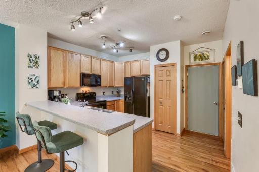 The beautiful kitchen combines style and functionality, featuring ample cabinetry, generous counter space, and designed for everyday living and entertaining. Open to the adjoining dining and living areas, the kitchen is the heart of the home!