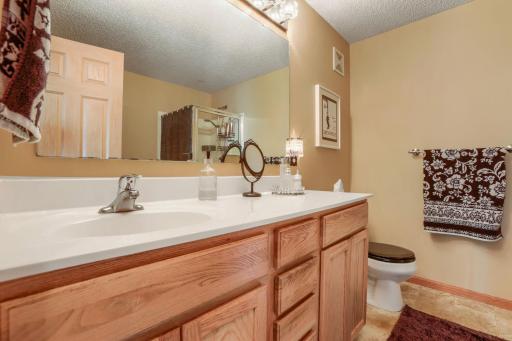 The private primary bath is designed for comfort and relaxation, featuring both a soaking tub and separate shower. This well-designed space offers the perfect setting to unwind after a long day.