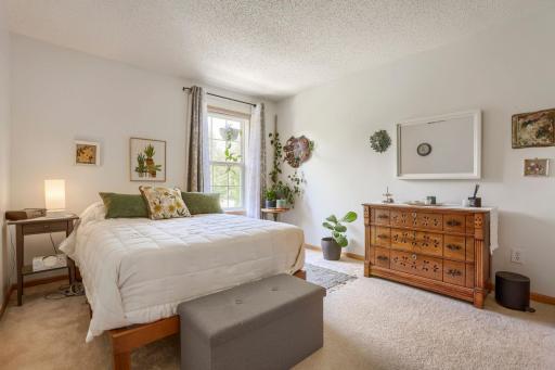 The spacious second bedroom offers comfort and versatility, making it ideal for family members or guests. Featuring ample closet space and abundant natural light, this inviting room provides a welcoming retreat.