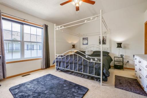Retreat to the spacious primary bedroom featuring two walk-in closets that provide exceptional storage and organization. The private en-suite bath offers comfort and convenience, creating a relaxing space to begin and end each day.