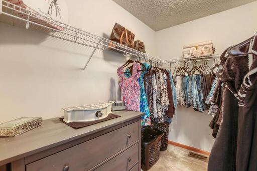 One of two generous walk-in closets featured in the primary suite, providing abundant storage and a well-organized space for your wardrobe and accessories.
