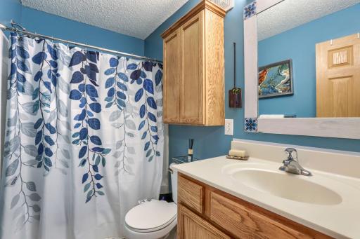 The second full bathroom is thoughtfully designed to serve family members and guests with ease. Located near the secondary bedroom and loft area, it enhances the townhome's practical and versatile floor plan.