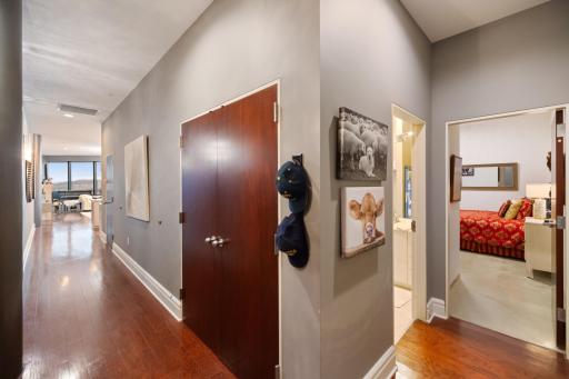 Wide and welcoming hallway offering a comfortable sense of space as you enter the unit.