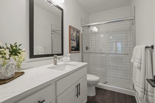 Sleek Modern Bathroom Featuring Quartz Surfaces & Fresh Tiled Shower!