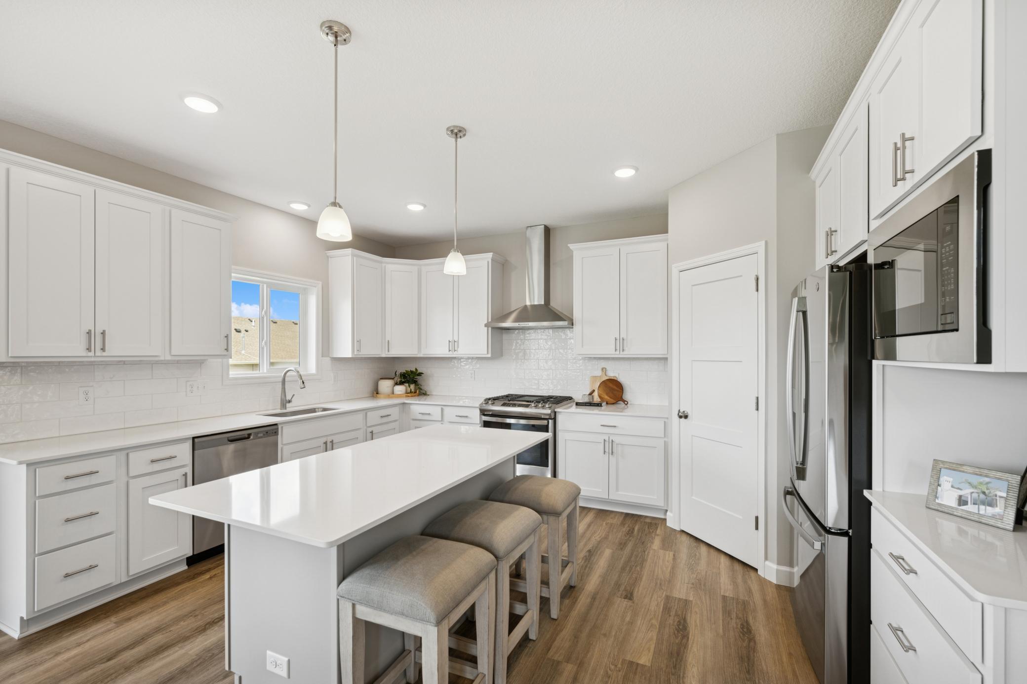 Kitchen - photo is of a previous inventory home. Inquire for more details and options.
