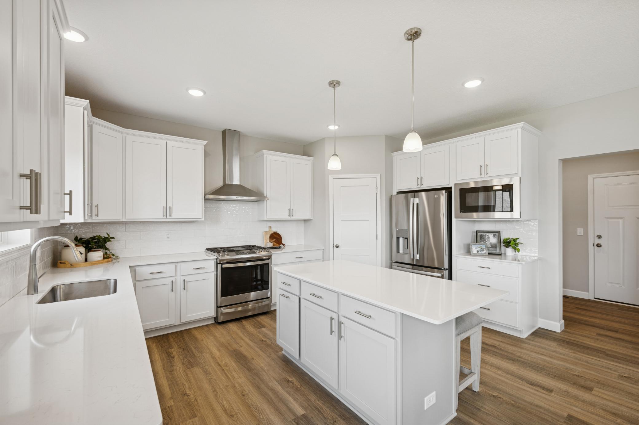 Kitchen - photo is of a previous inventory home. Inquire for more details and options.