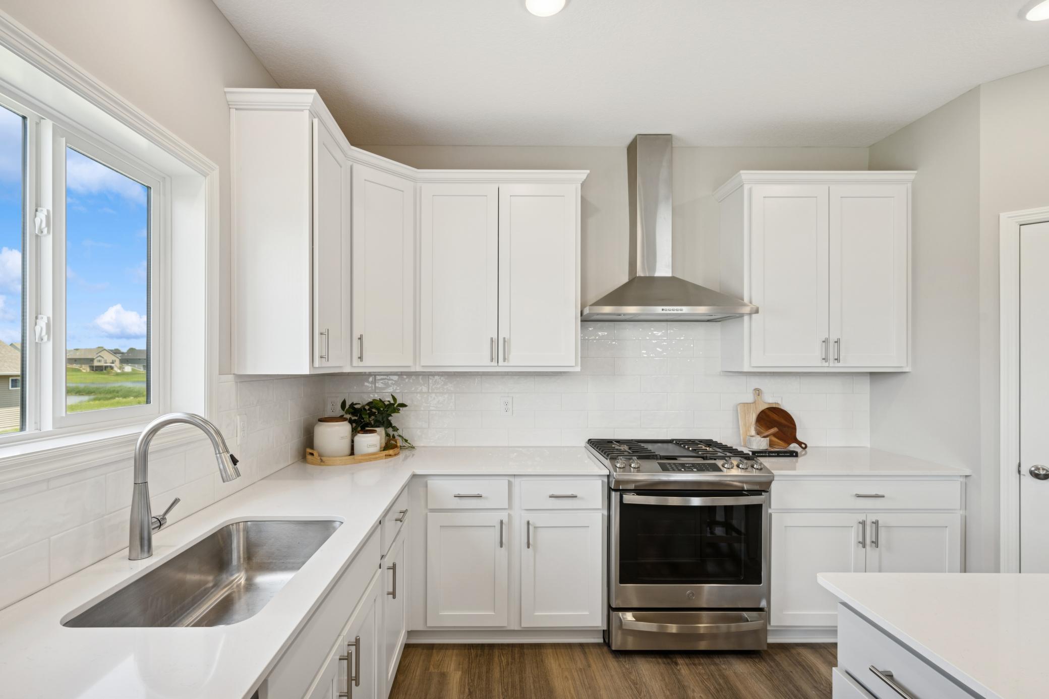 Kitchen - photo is of a previous inventory home. Inquire for more details and options.
