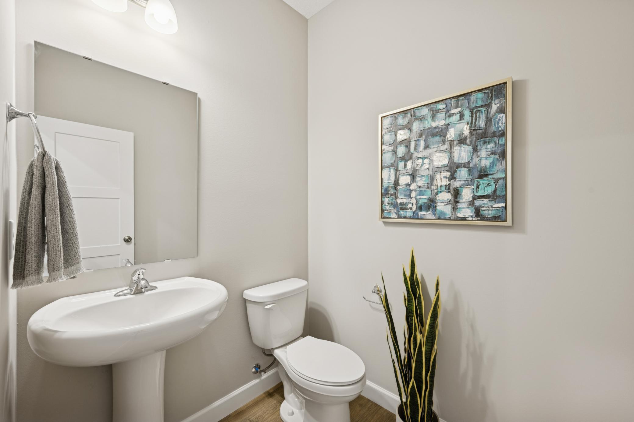 Main Floor Bathroom - photo is of a previous inventory home. Inquire for more details and options.