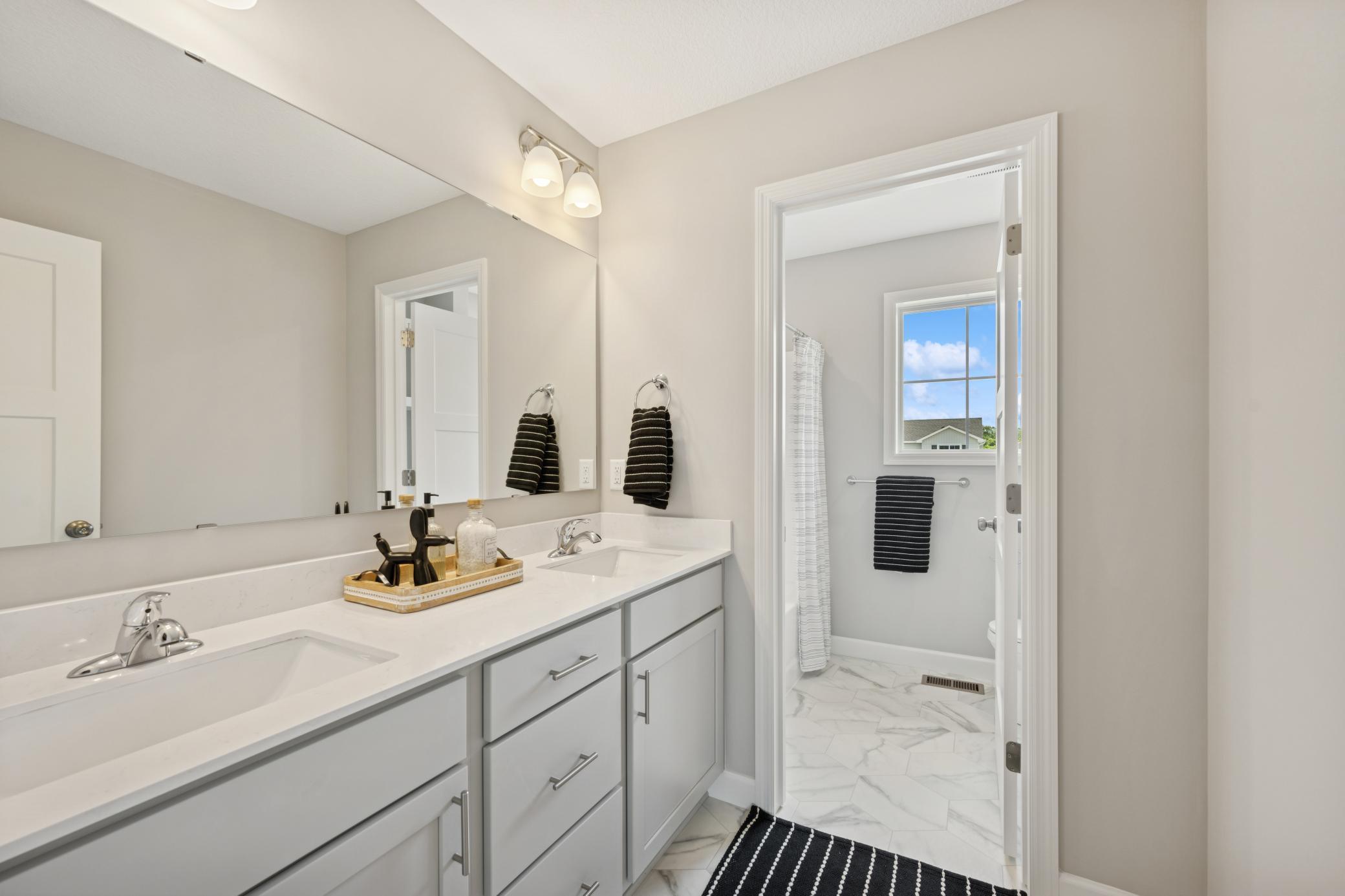 Upstairs Bathroom - photo is of a previous inventory home. Inquire for more details and options.