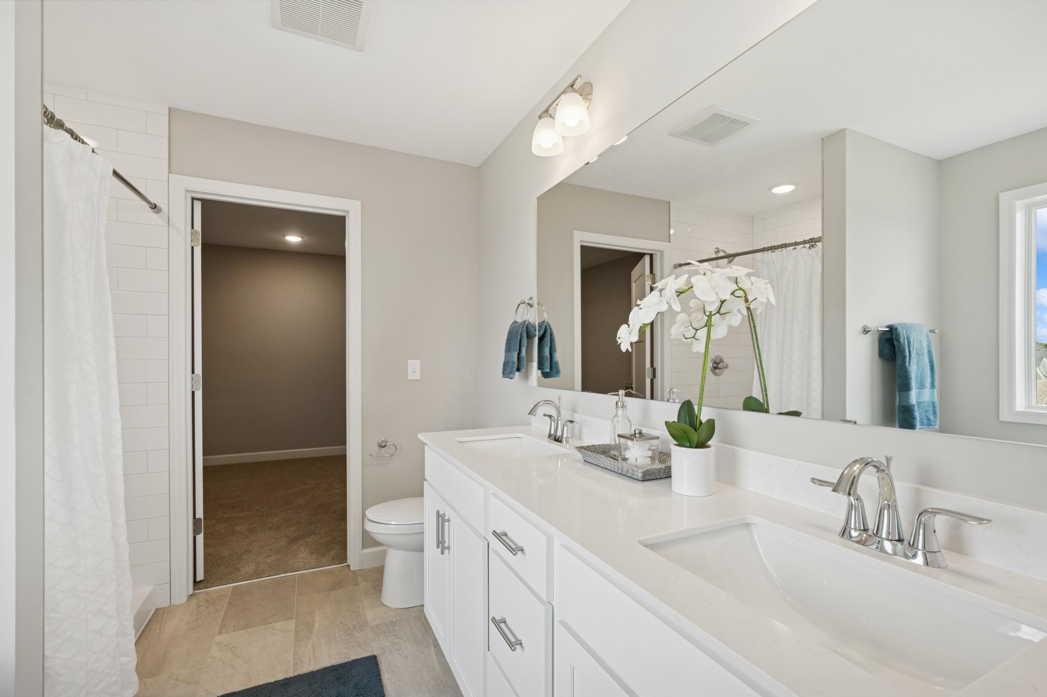 Primary Luxury Bathroom - photo is of a previous inventory home. Inquire for more details and options.