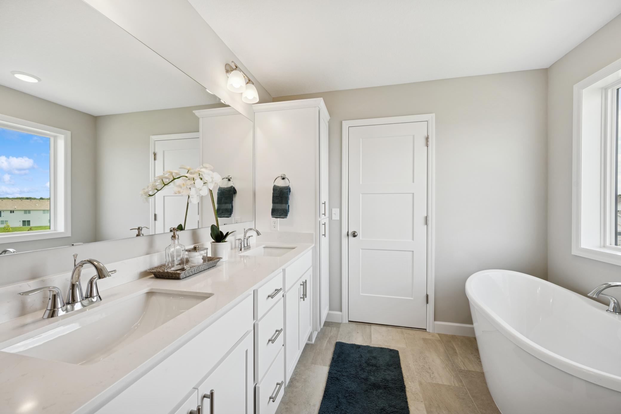 Primary Luxury Bathroom - photo is of a previous inventory home. Inquire for more details and options.