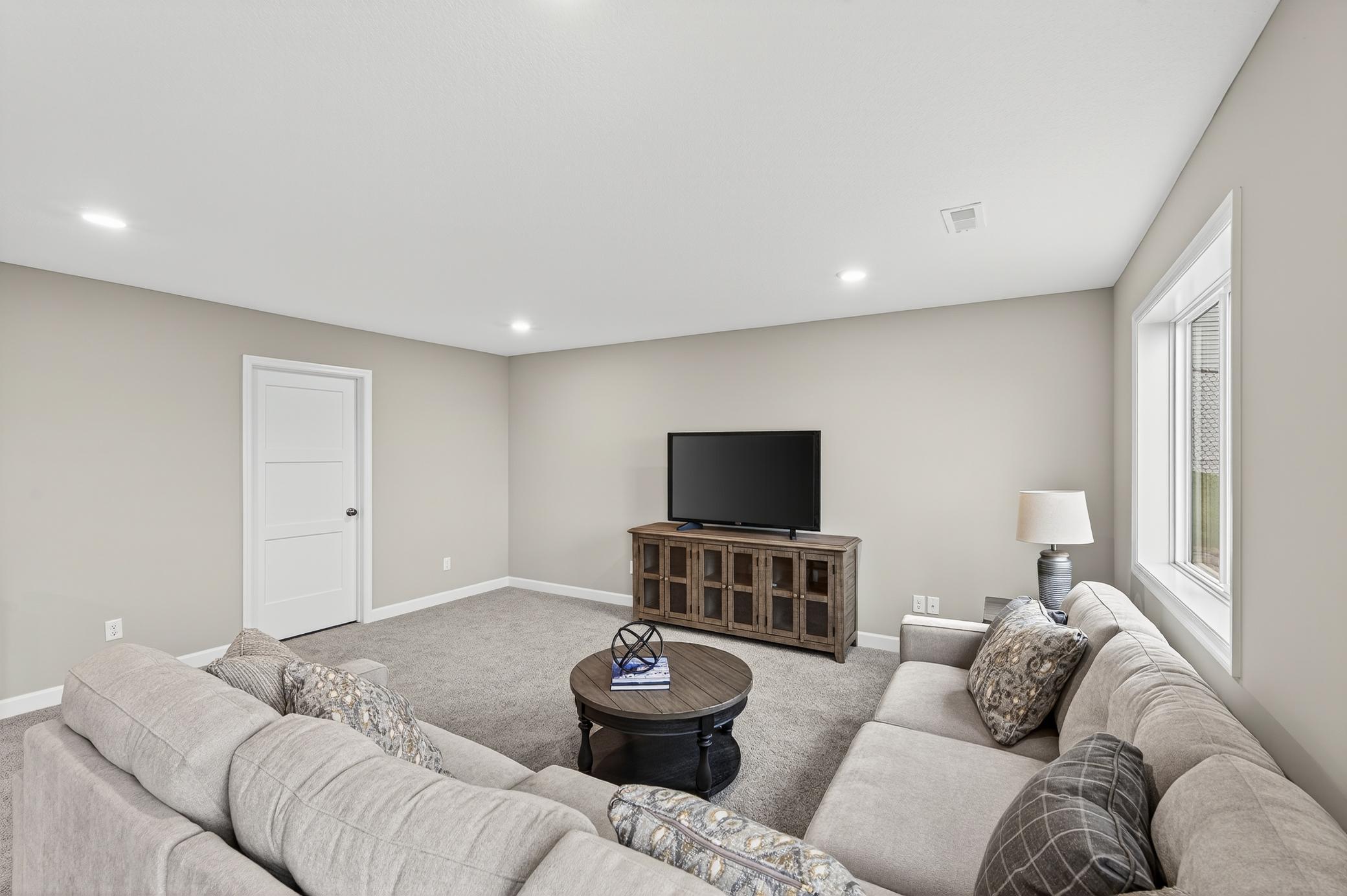 Finished Lower Level - photo is of a previous inventory home. Inquire for more details and options.