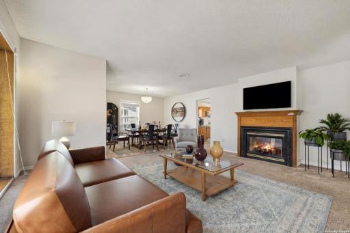 Living Room with Two-Sided Gas Fireplace: The Heart of the Home (virtually staged to show potential layout)