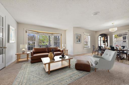 Creates ambiance and warmth across living and dining areas. This is what makes the layout special (virtually staged to show potential layout)