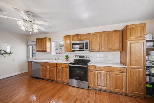 All stainless steel appliances less than 2 years old. Built-in spice racks and pull-out shelves in lower cabinets make this kitchen work hard