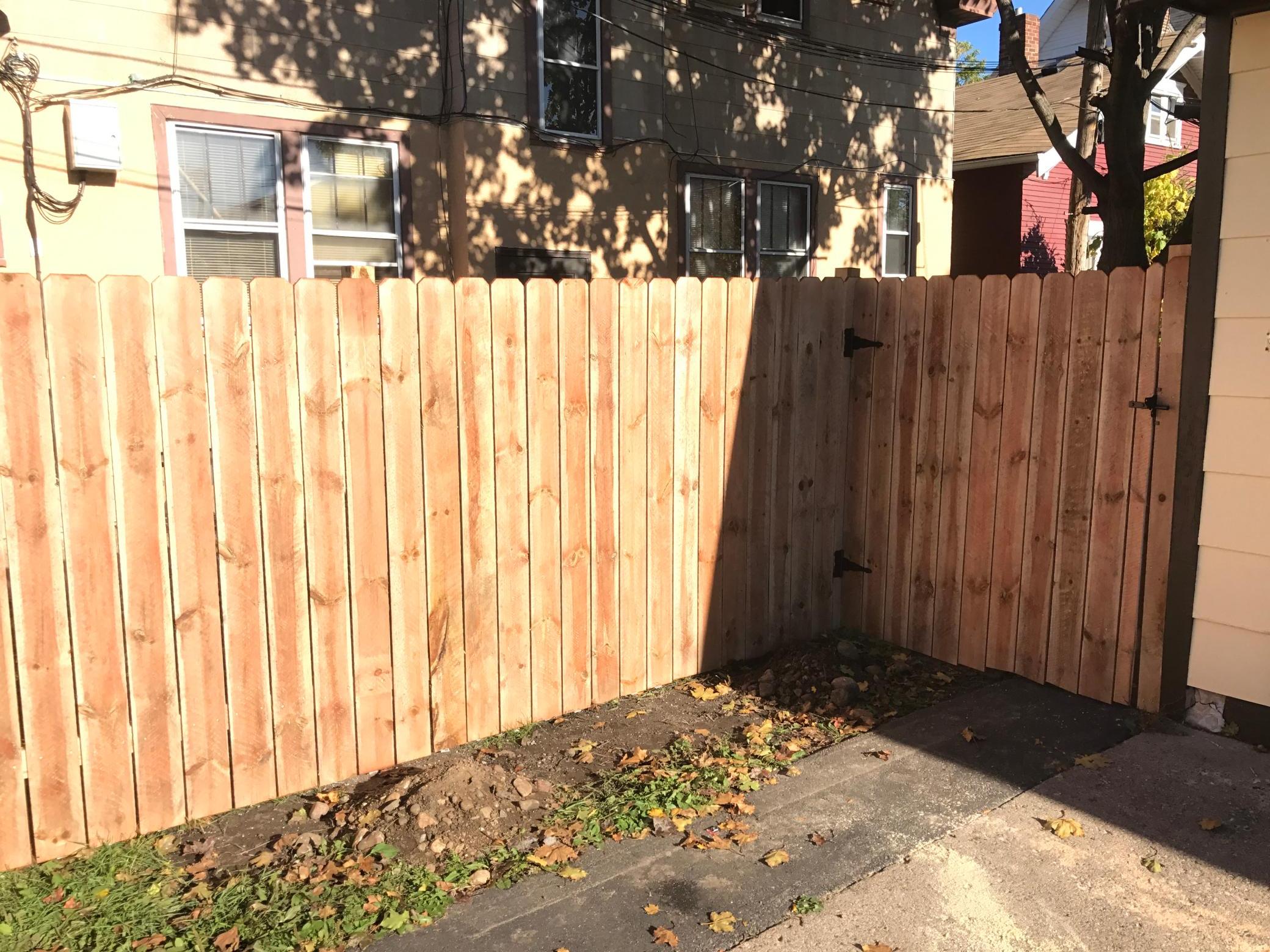 Newer privacy fence along driveway