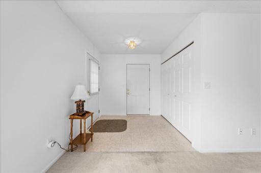 Entryway with coat closet.