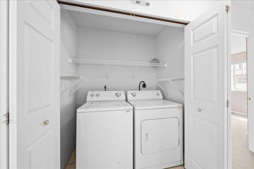 Easy access to -washer/dryer but can be hidden behind doors.