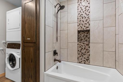 Stunning tile work with main floor laundry.