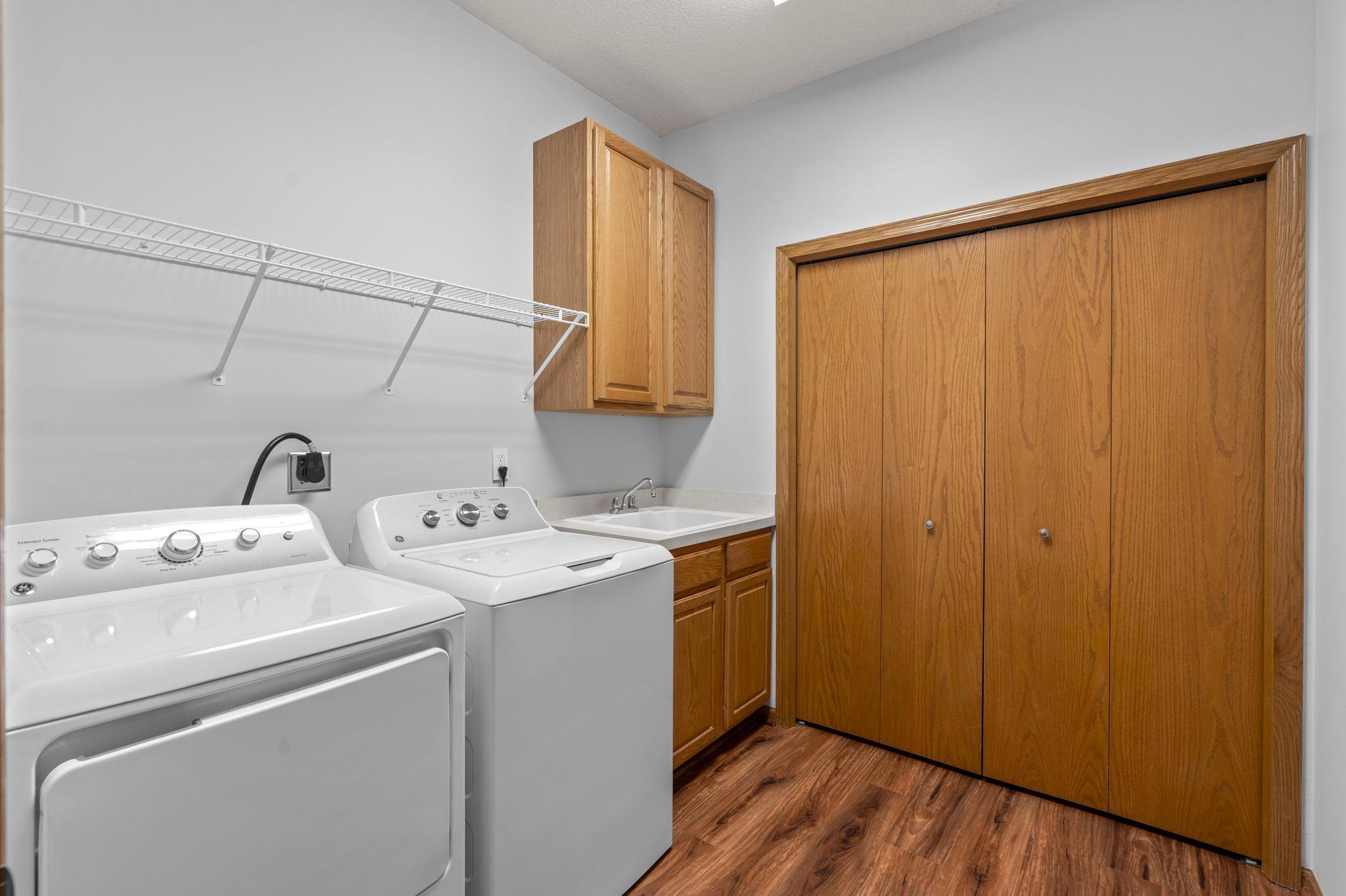 All facilities on the main level. Enjoy easy, low maintenance lifestyle with laundry on the main. Build-in cabinets and shelving for easy storage.