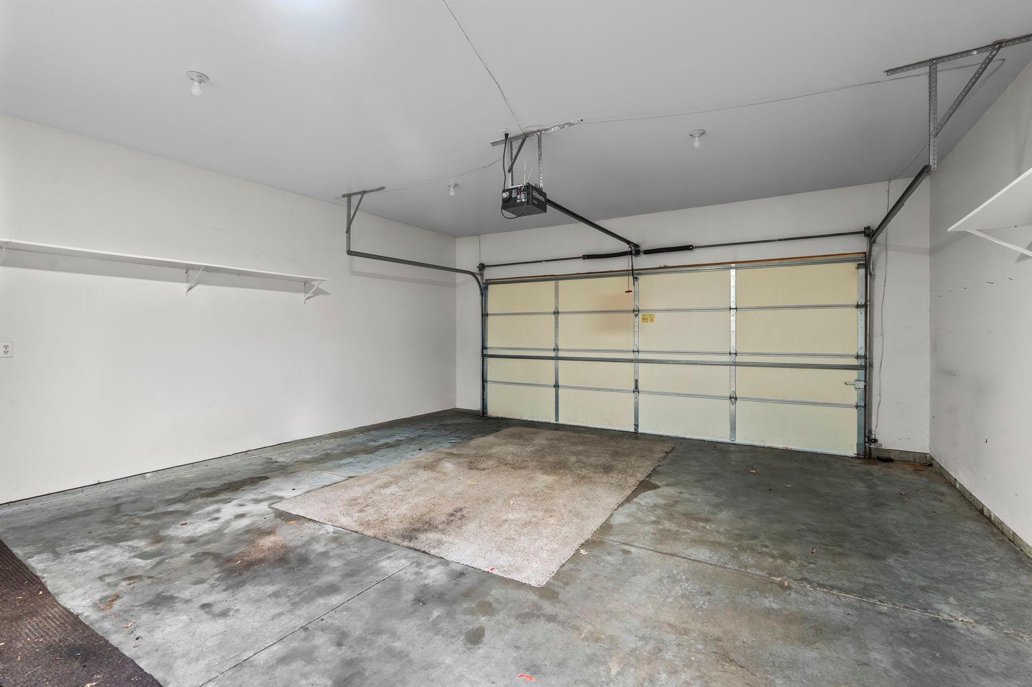 Extra large, 2 car garage space and sotrage cabinets, workbench.