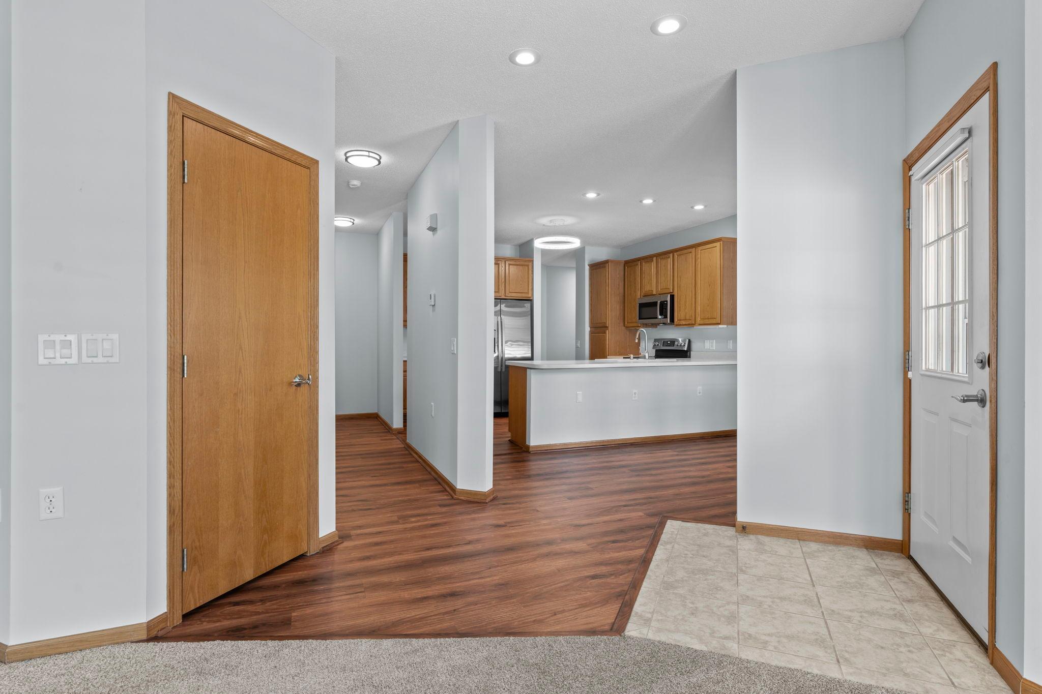 Lovely LVP flooring spans the kitchen and hallway.