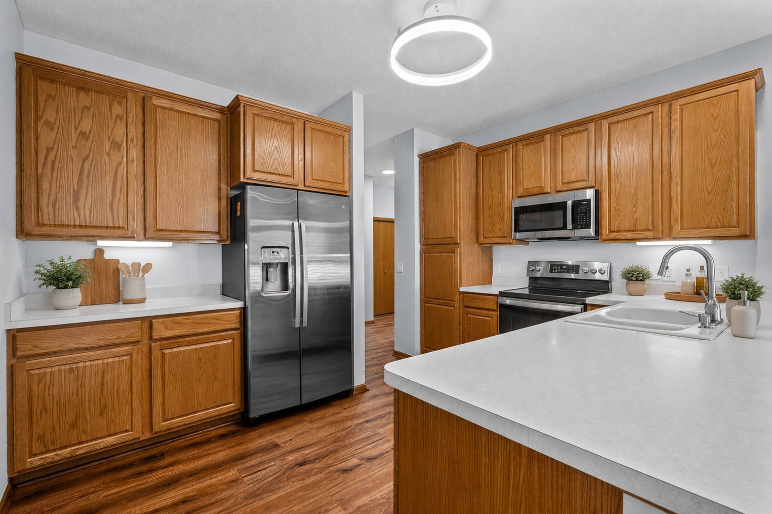 A abundance kitchen cabinetry offers great storage for all things kitchen. (Virtually staged to highlight this home's features).