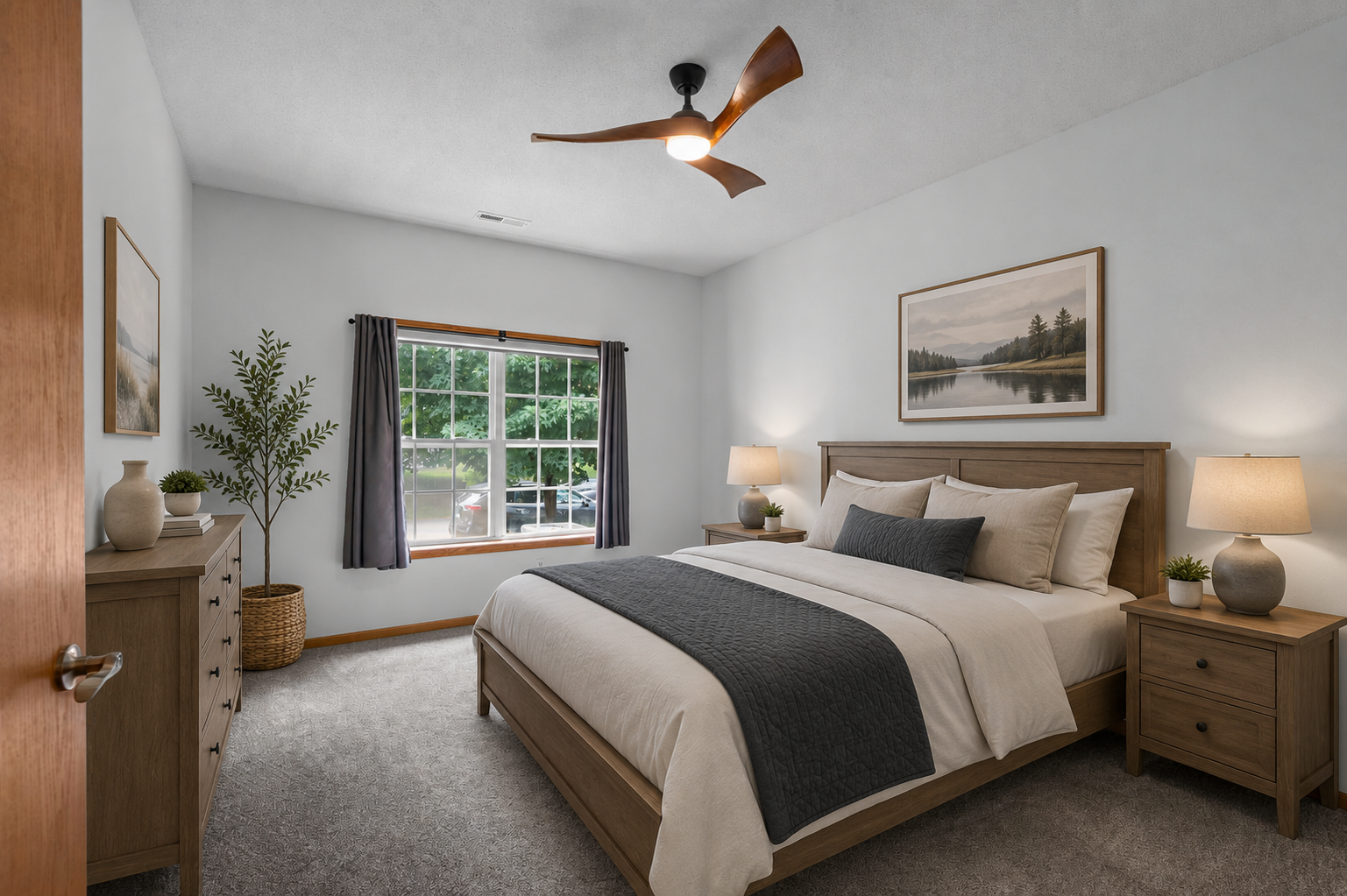 Main level primary bedroom with ensuite bathroom and large closet.