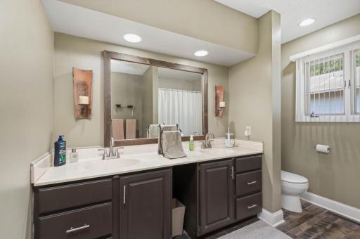 The walk thru full bath on the upper level features a double vanity.