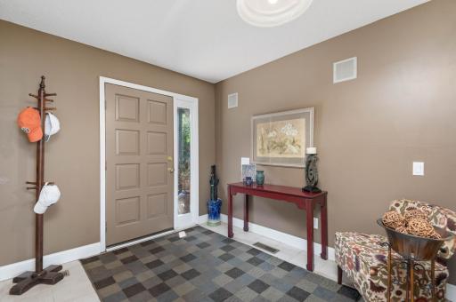 Greet family and good friends in the large ceramic tile entryway.