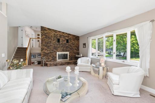 You will appreciate the bright, vaulted living room with a floor to ceiling Chicago brick fireplace.