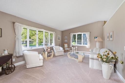 Relax with guests or enjoy your favorite book in the sun filled, vaulted living room.