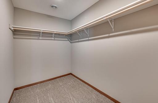 Finished lower level shown is from a previous model home. Lower-level finishing is available as an upgrade for an additional cost. Choose from a variety of colors, cabinets, trims, etc. All photos are from a similar model home.