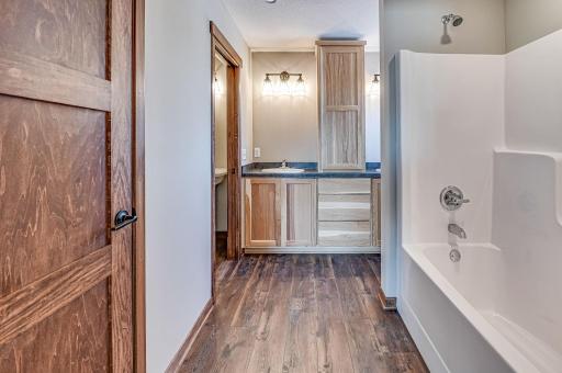 Finished lower level shown is from a previous model home. Lower-level finishing is available as an upgrade for an additional cost. Choose from a variety of colors, cabinets, trims, etc. All photos are from a similar model home.