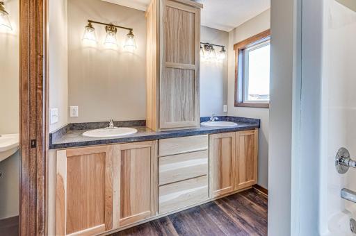 Finished lower level shown is from a previous model home. Lower-level finishing is available as an upgrade for an additional cost. Choose from a variety of colors, cabinets, trims, etc. All photos are from a similar model home.