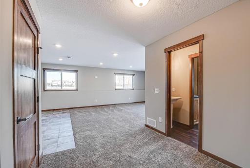 Finished lower level shown is from a previous model home. Lower-level finishing is available as an upgrade for an additional cost. Choose from a variety of colors, cabinets, trims, etc. All photos are from a similar model home.