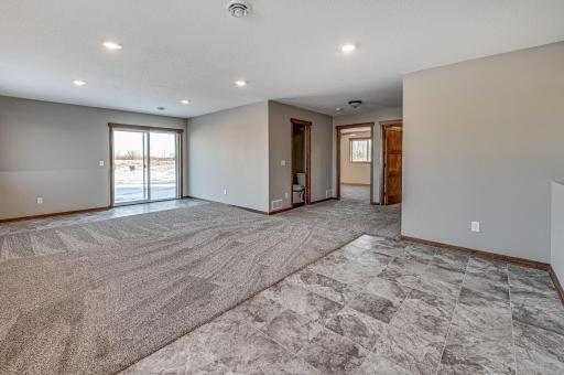 Finished lower level shown is from a previous model home. Lower-level finishing is available as an upgrade for an additional cost. Choose from a variety of colors, cabinets, trims, etc. All photos are from a similar model home.