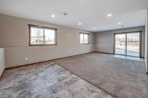 Finished lower level shown is from a previous model home. Lower-level finishing is available as an upgrade for an additional cost. Choose from a variety of colors, cabinets, trims, etc. All photos are from a similar model home.